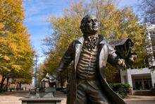 Mason statue on Fairfax Campus in fall